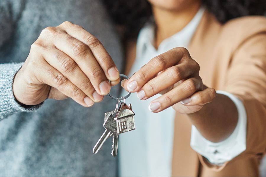 Couple holding the keys of their house