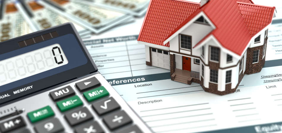 A model house with a calculator next to it